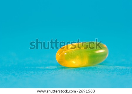 yellow pill on blue background