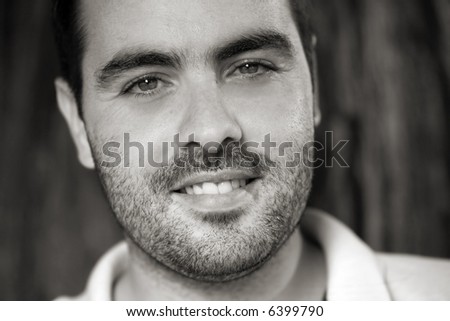 Portrait of a handsome young man in black and white