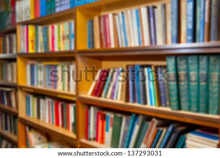 shelf with books in the library background. the image was blurred for use as a background.
