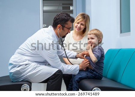 mother and her little son checked by a doctor at the hospital