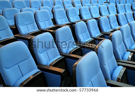blue chair seats in an empty conference room