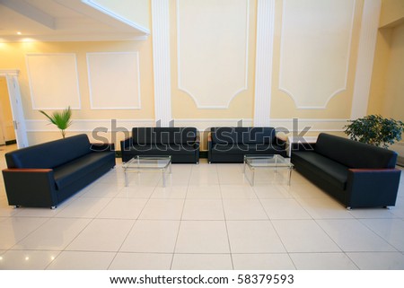 wide angle shot of a conference hall with couches