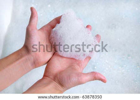 clean male hands washing with soap foam bubbles