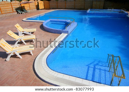 outdoor tiled swimming pool with clean blue water
