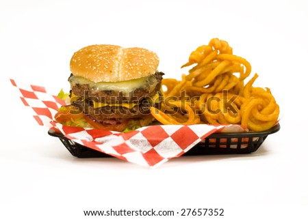 A tray with a Juicy Burger and with curly fries.
