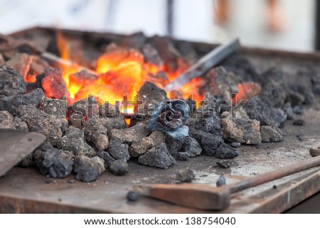 Forge fire in blacksmith\'s where iron tools are crafted