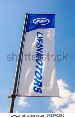 SAMARA, RUSSIA - MAY 25, 2014: The flag of Lifan Motors over blue sky. Lifan Group is a privately owned Chinese motorcycle and automobile manufacturer headquartered in Chongqing, China