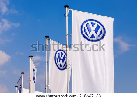SAMARA, RUSSIA - SEPTEMBER 21, 2014: The flags of Volkswagen over blue sky. Volkswagen is the biggest German automaker and the third largest automaker in the world