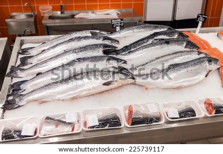 SAMARA, RUSSIA - OCTOBER 5, 2014: Raw fish in ice ready for sale at the supermarket Magnit. Russia\'s largest retailer. It was founded in 1994 in Krasnodar.