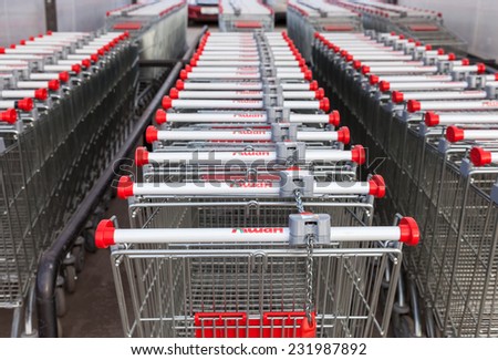 SAMARA, RUSSIA -  NOVEMBER 16, 2014: Large empty red shopping cart Auchan store. French distribution network Auchan unites more than 1300 shops