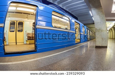 SAMARA, RUSSIA - DECEMBER 20, 2014: Blue subway train standing at the underground station. Wide angle