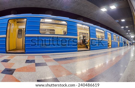 SAMARA, RUSSIA - DECEMBER 20, 2014: Blue subway train standing at the underground station. Wide angle