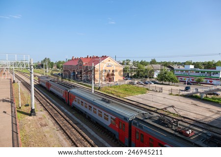 OKULOVKA, RUSSIA - JULY 2, 2014: View of Rail Terminal and rail ways in summer sunny day. Railway station on the October railway between Moscow and St. Petersburg