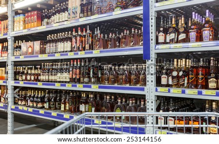 SAMARA, RUSSIA - FEBRUARY 15, 2015: Showcase alcoholic beverages at the hypermarket METRO. Metro Group is a German global diversified retailer