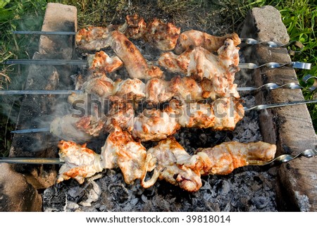 Close up photo of cooking meet on the open fire