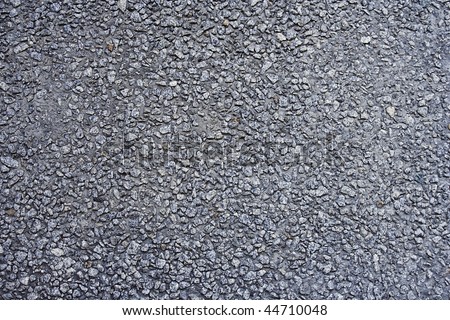Pebble gravel texture. Outer coating of plinth wall.
