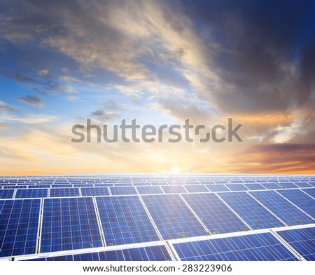 Solar panels with sunset\'s sky