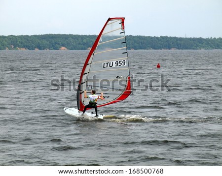 KAUNAS, LITHUANIA, JUNE 14: Windsurfer at Kaunas sea on June 14, 2013 in Kaunas, Lithuania.