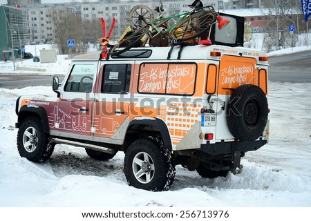 VILNIUS, LITHUANIA - FEBRUARY 10: Advertising car and winter in capital of Lithuania Vilnius city Pasilaiciai district on February 10, 2015, Vilnius, Lithuania.