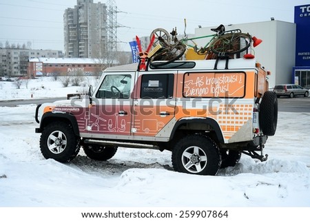 VILNIUS, LITHUANIA - FEBRUARY 10: Advertising car and winter in capital of Lithuania Vilnius city Pasilaiciai district on February 10, 2015, Vilnius, Lithuania.