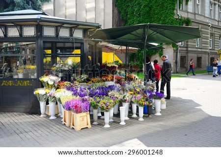 VILNIUS, LITHUANIA - JUNE 25: Flowers seller in Vilnius city street on June 25, 2015, Vilnius, Lithuania.