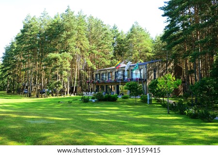 ANDRIONISKIS, LITHUANIA - AUGUST 1: House in forest in Andrioniskis town Anyksciai district on August 1, 2015, Andrioniskis, Lithuania.