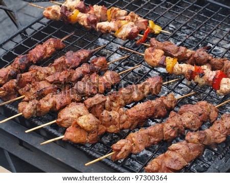 Cooking food - grilled mutton with vegetables.