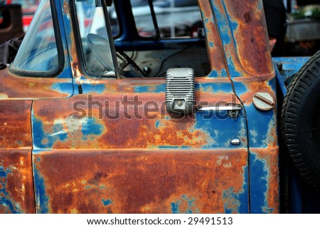 Rusty old truck with drive-in movie theater speaker