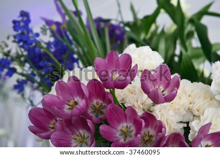stock photo FLOWER BOUQUET ON WEDDING TABLE SETTING WITH BLUE PURPLE AND 