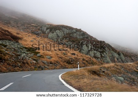 Turn at St. Gotthard Road during the fog. Switzerland