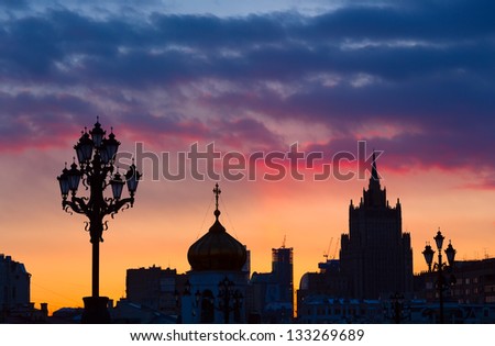 Silhouettes of  lanterns, dome and high-altitude building in the sunset, Moscow, Russia