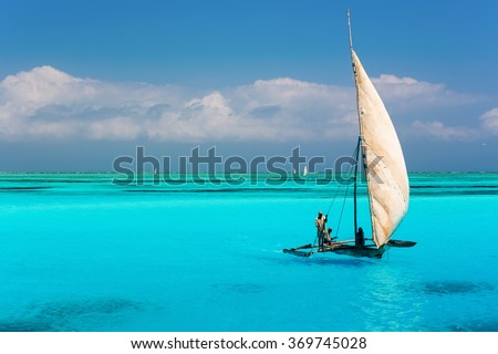 Catamaran on amazing turquoise water in the Indian ocean next to Mnemba atoll, Zanzibar, Tanzania