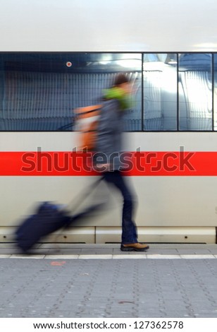Travel Image Of A Motion Blurred Student Rushing To Catch A Train