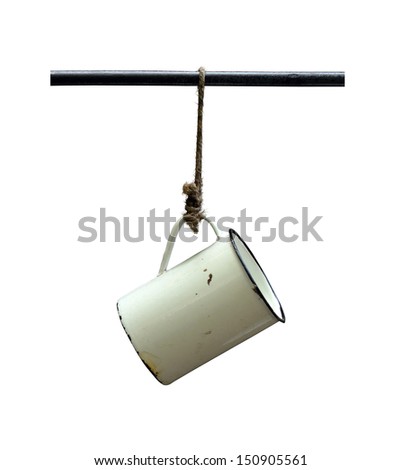 Isolation Of An Old Tin Camping Cup Hanging On A String