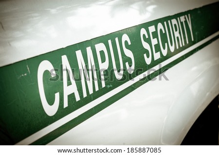 Retro Filtered Campus Security Sign On The Side Of A University Vehicle