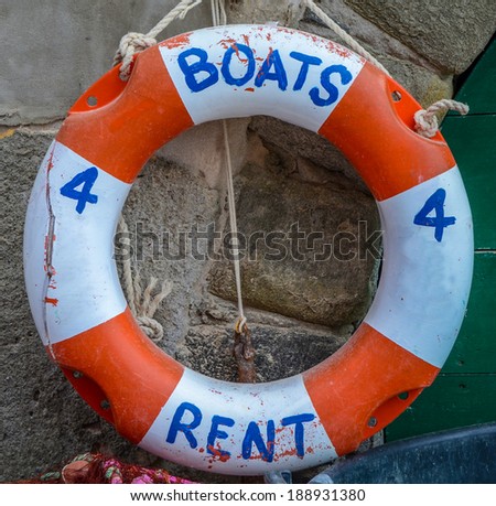 Tourism Image Of A Rustic Boats For Rent Sign On A Lifebuoy