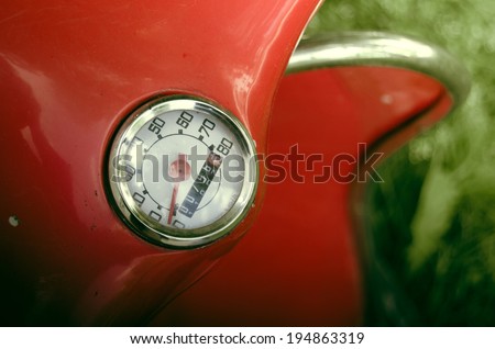 Detail Of A Speedometer On A Red Retro Vintage Moped Or Scooter