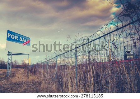 A For Sale Billboard Sign In An Urban Industrial Wasteland Or Vacant Lot