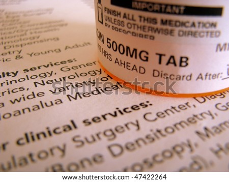 Health-care image of prescription medicine on top of medical documentation