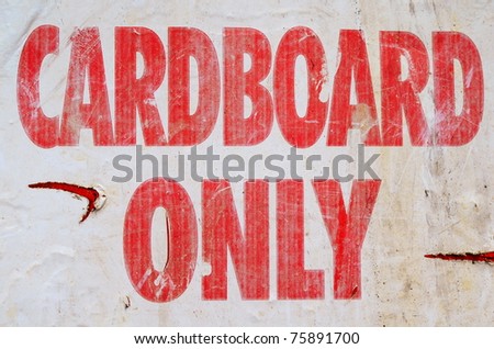 Environmental Image Of A Grungy Cardboard Only Recycle Sign