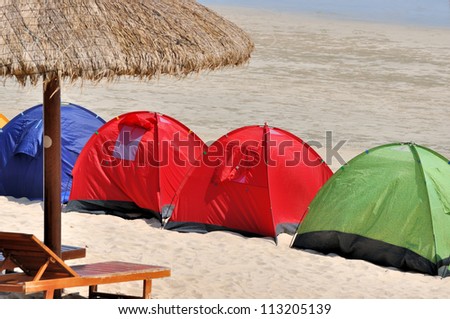 Umbrella and tent on seaside