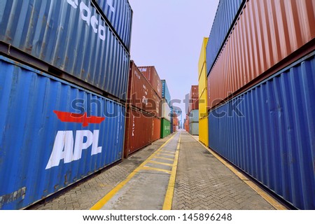 XIAMEN - APRIL 21: Container goods yard in harbor of Xiamen, Fujian, South of China in April 21, 2013. Xiamen is a developing harbor city located in South-east of China