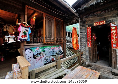 FUJIAN - APRIL 6: Aged architecture with modern shop in countryside of Fujian Province, South of China in April 6, 2013. As country life style and residence environment in South of China.