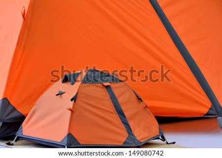 Big tent and small tent in orange