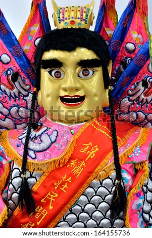 XIAMEN- OCTOBER 26: Doll in Chinese traditional dress in ceremony, in Xiamen City, South of China in October 26, 2013. Xiamen is a famous harbor city located in South-east of China.