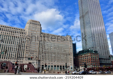 CHICAGO, USA - OCTOBER 6: Merchandise Mart and city buildings beside Chicago river in downtown of Chicago, Illinois, in October 6th, 2014.Chicago is the biggest city in North of USA