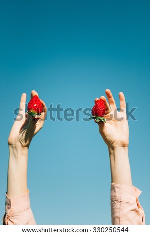 juicy fresh strawberries in hand