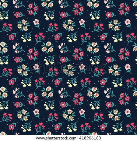 Cute pattern in small flower. Small colorful flowers. Dark blue background. Spring floral background. The elegant the template for fashion prints.
