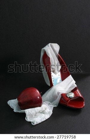 White stocking, red apple, red heel.  How tempting... is this fruit forbidden?