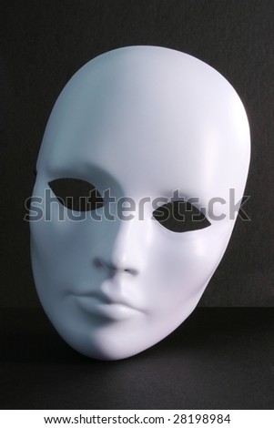 Plain white mask against a dark background.